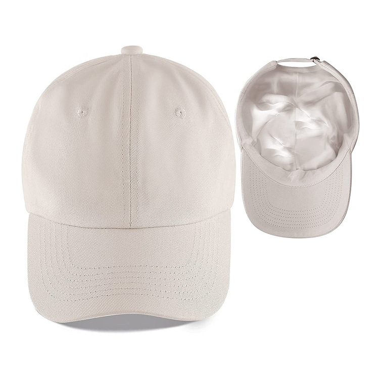 The Satin-Lined Cap in Ivory, with the satin-lined inside shown